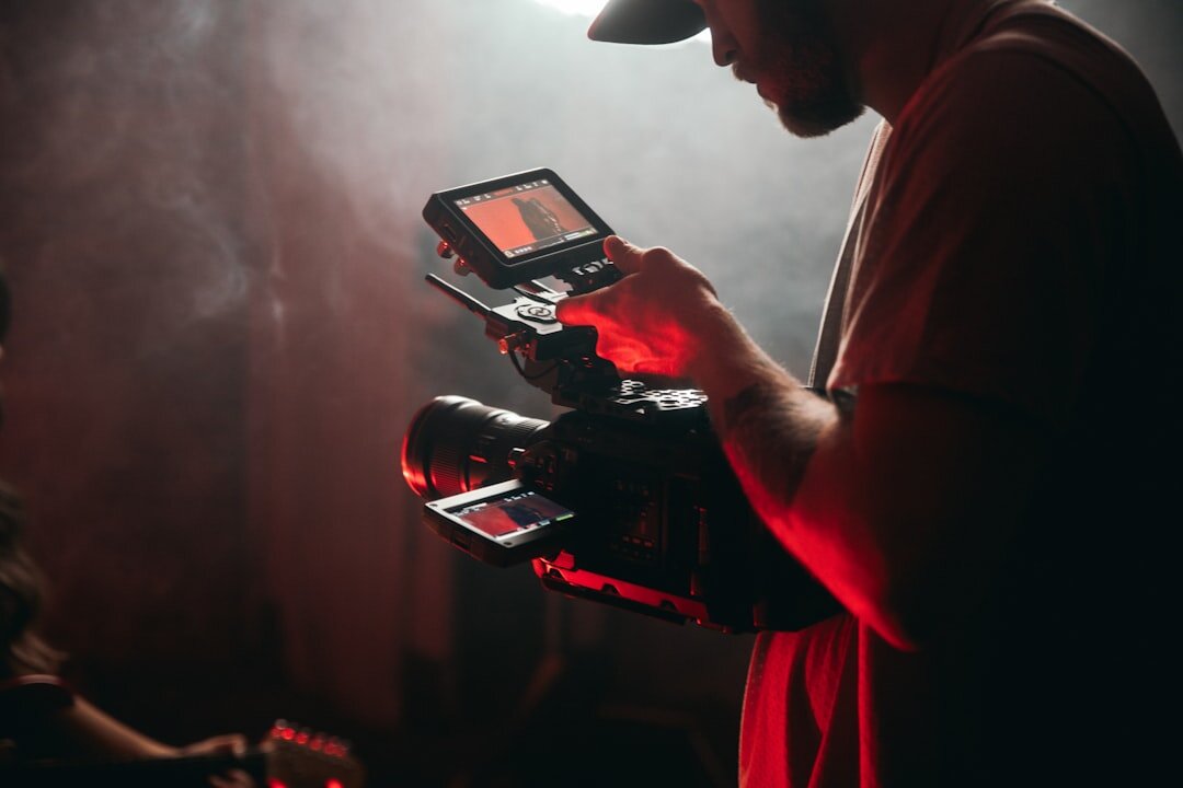Video production team working with cameras and lighting equipment