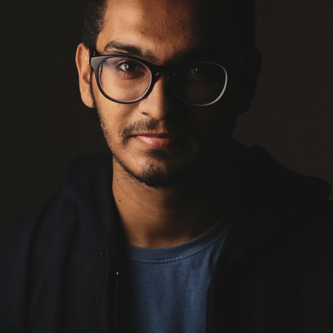 Turkish male broadcast journalist instructor with glasses