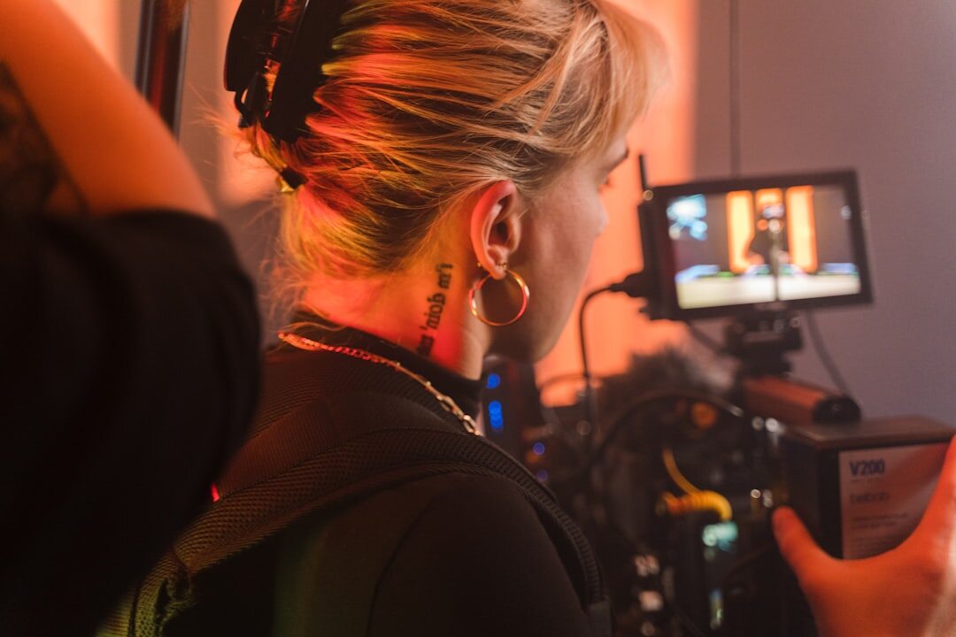 TV journalist reporting in front of a camera in a studio