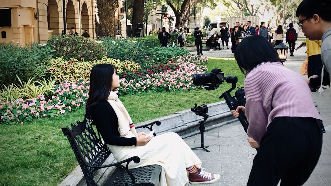 Journalist interviewing subject with microphone outdoors